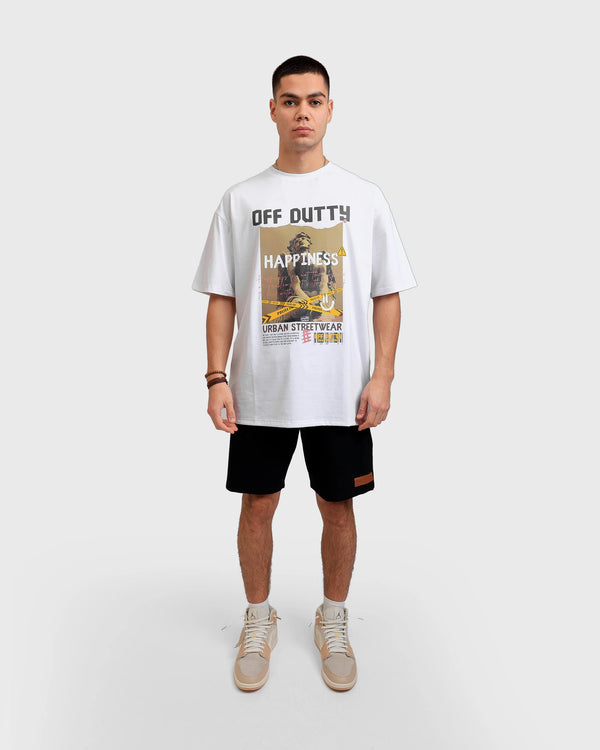 Front photo of a white Turkish look a like male model in a light grey backdrop wearing 'What Is Happiness' white relaxed T-shirt from Off Dutty's 'Rare and Radiant' collection, paired with Off Dutty Black Short "Signature Brown Leather Logo Detail on Left" and an Air Jordan 1 Mid 'Milan' sneaker. He accessorizes with necklaces, three bracelets on his right hand.