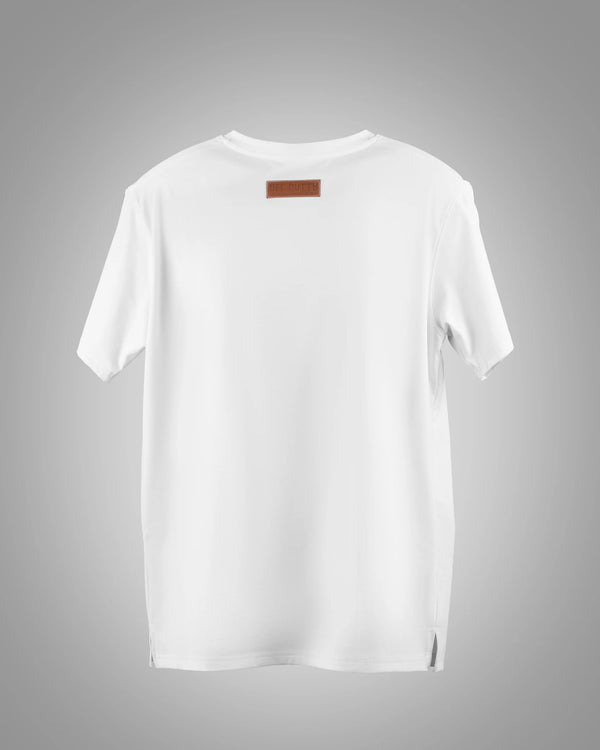 Third photo is the back view of Off Dutty's 'Embracing Your Presence' white relaxed t-shirt from the 'Rare and Radiant' collection, showcased against a light grey background, emphasizing the sleek and clean design of the tee's rear.