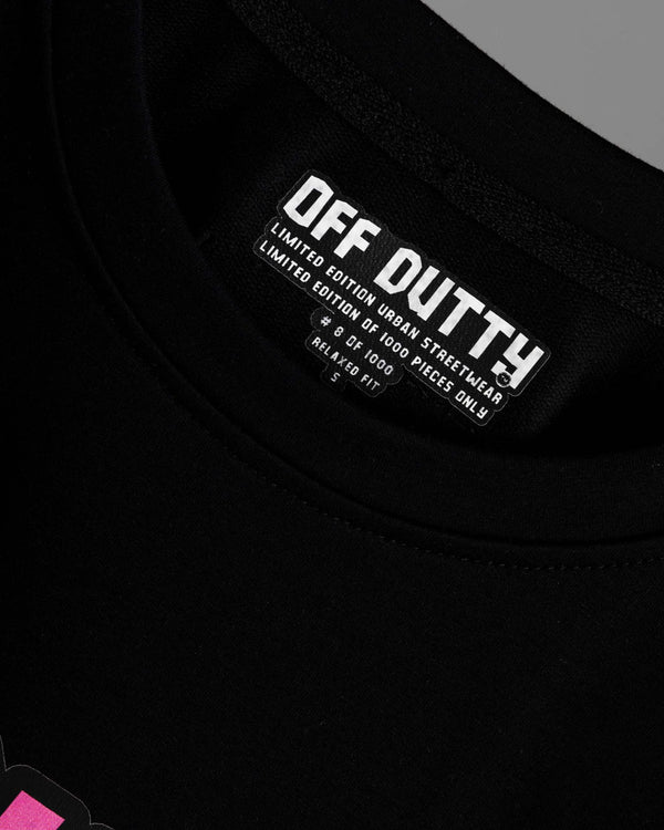 Close-up of the inside label of Off Dutty's 'What Is Happiness' black relaxed t-shirt, showcasing the printed Off Dutty logo and 'Limited Edition Urban Streetwear' text. The label also highlights the t-shirt's unique number in the limited series of 1000, its 'Relaxed Fit' designation, and the size of the garment.